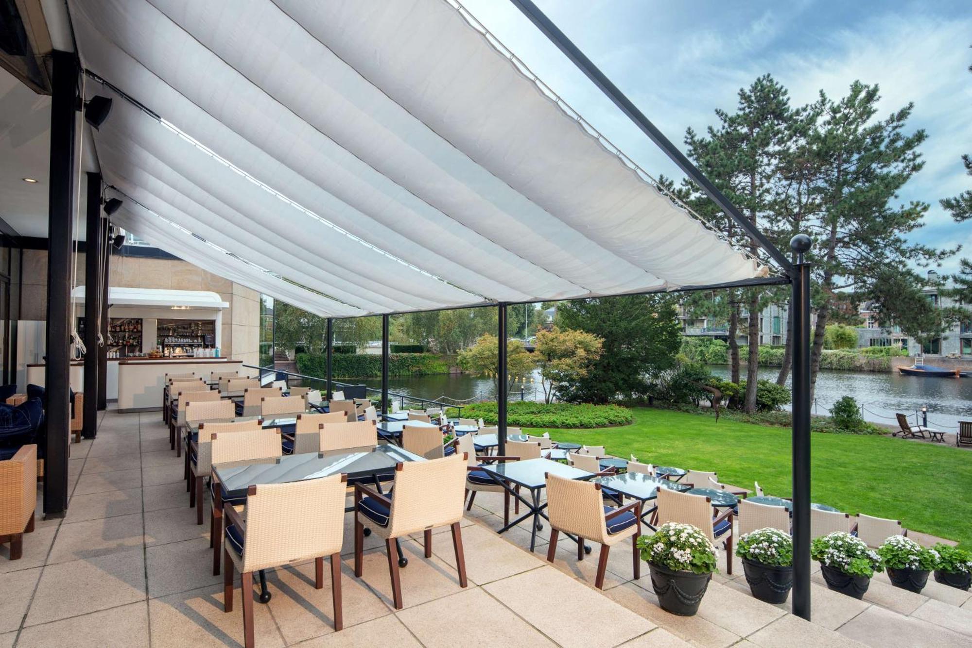 Hilton Amsterdam Hotel Exterior photo A retractable awning